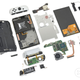 A photo showing the new Nintendo Switch — OLED Model broken down to its component parts.